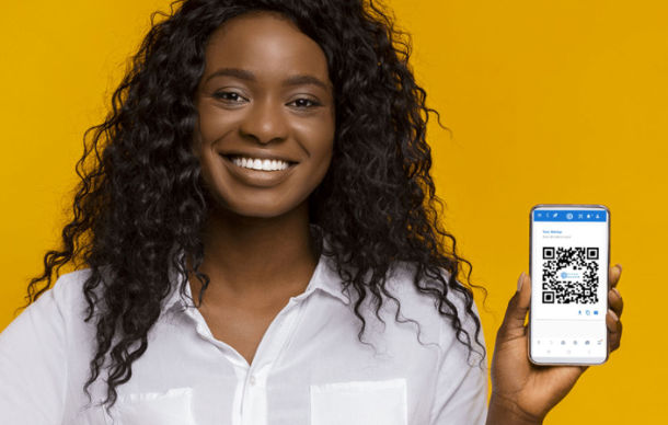startup woman entrepreneur looking straight with PitchScore app on phone in hand